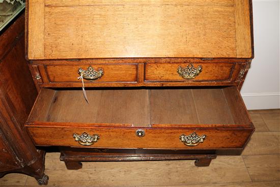 A George III oak bureau, W.91cm